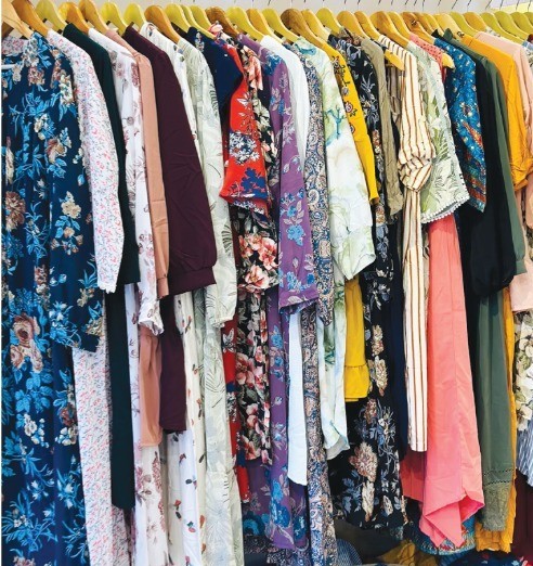 Cotton kurtas, tunics, and dresses on the Aparajita studio rail